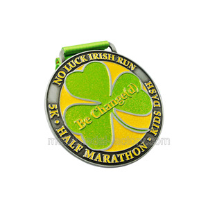 Running game finisher medal with green ribbon